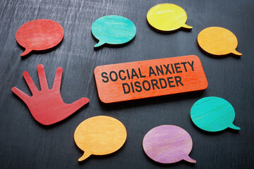Plate with phrase social anxiety disorder and speech bubbles.