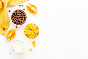 Healthy corn flakes with fruits for breakfast, top view