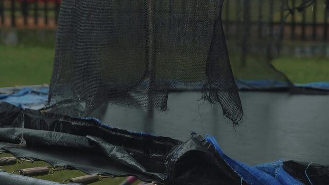 Destroyed trampoline after the storm.
Video footage of wet damaged springboard.