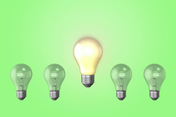 lightbulb light bulb moment idea imagination concept inspiration concept lit glowing old style light bulbs lightbulbs green background