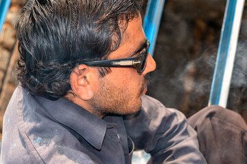 Fototapeta premium Construction worker welding iron with glasses on