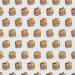 Pattern of bread roll on white background.