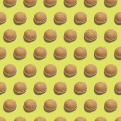Pattern of fresh burger bread . Burger on yellow background.