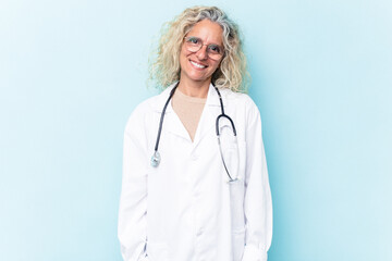 Middle age caucasian woman isolated on blue background happy, smiling and cheerful.