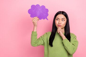 Photo of think brunette young lady hold look cloud wear green jumper isolated on pink color background