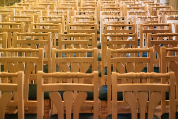 Background row wooden chairs indoors in theatre or conference room in design interior abstract. Design abstract backgrounds concept. Assembly hall in museum room. Copy text space