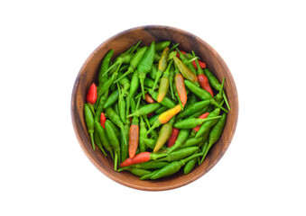 Paprika (Thai) in a wooden bowl isolated on white background. Top view.