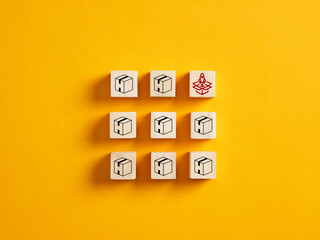 New product development, launching and innovation. Wooden cubes with product boxes and a launching...