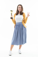 An emotional brunette holds the gold cup of the winner of the competition in her hands on a white isolated background