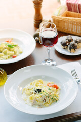 Traditional italian pasta with mushrooms in a restaurant