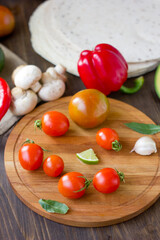 Few Cherry tomatoes on a wooden board