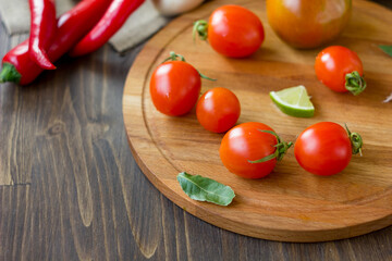 Few Cherry tomatoes on a wooden board
