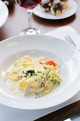 Traditional italian pasta with mushrooms in a restaurant