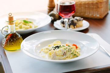 Traditional italian pasta with mushrooms in a restaurant