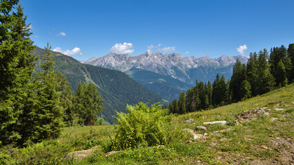 Fototapeta premium Summer landscape in mountains and blue sky with clouds. Location place Alps, Tyrol, Austria, Europe.