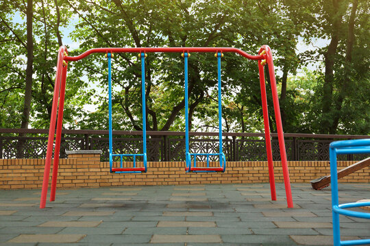 Children's Playground With New Colorful Swing Set