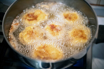 Chef Preparing Bull Balls or Testicles on a Kitchen Board