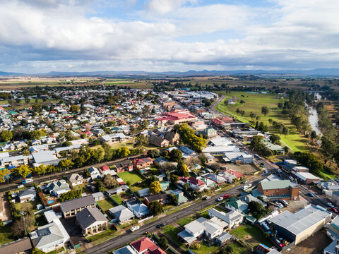 Australian country town with river beside on sunlit day