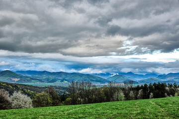 Beautiful hilly landscape with grey cloudy sky. View of the valley. Vrsatec, Slovakia