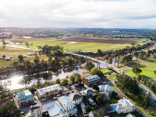 New England Highway bridge over Hunter river with traffic going through Singleton town
