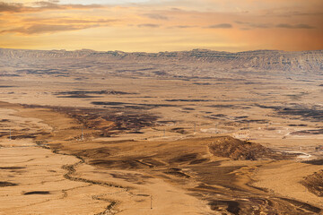 Ramon Crater Makhtesh Ramon, the largest in the world, as seen from the high rocky cliff edge surrounding it from the north, Ramon Nature reserve, Mitzpe Ramon, Negev desert, Israel. High quality