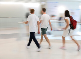 Obraz premium Abstract image of people in motion with blurred background