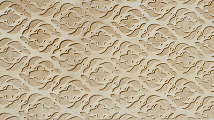 Vintage stucco ornate of beige colour on the wall outside downtown in Segovia, Spain