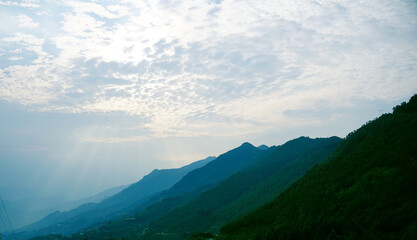 Mesmerizing view of sun rays on Ta Xua Mountain range of northern Vietnam