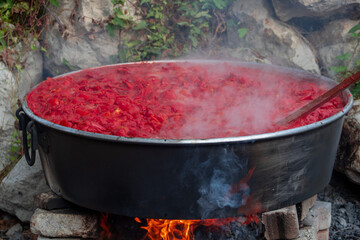 Fresh and organic tomato paste on the wood fire