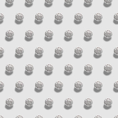 Chocolate cakes with white décor on white background. 