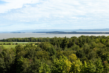 Fototapeta na wymiar Aerial view from the east end of the Island of Orleans, with a series of small islands in the St. Lawrence River, Quebec, Canada