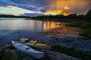 sunset over kayaks a late september day Stockholm archipelago