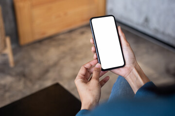 cell phone blank white screen mockup.hand holding texting using mobile on desk at office.background empty space for advertise.work people contact marketing business,technology