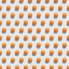 Pattern with clementine. Fresh ripe clementine on color background. The whole clementine on white background.