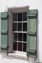 Window with green wooden shutters