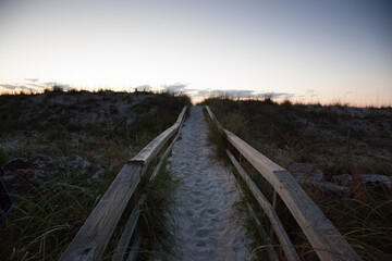Fototapeta premium Walkway to the beach at sunrise