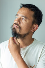 Fototapeta premium Smart asian moustache man thinking something beauty art fashion