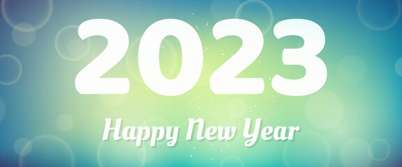 Happy new year 2023 incription on blurred background