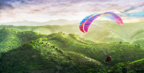 Paragliding multicolor. Paraglider flying over Landscape from the background Beauty nature mountain...