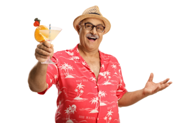 Happy mature male tourist in a red shirt toasting with a cocktail