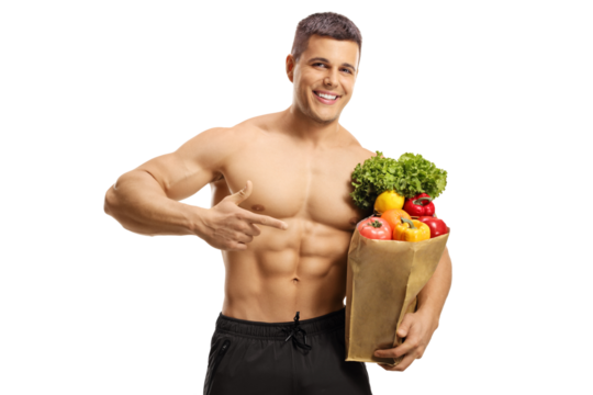 Handsome musuclar young man smiling and pointing at a bag of groceries - Powered by Adobe