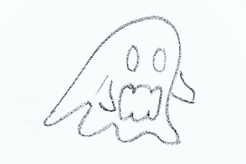 Black color oil pastel hand drawing in flying ghost shape on white paper background