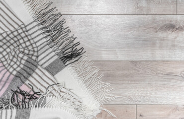 Warm blanket on the background of the laminate.