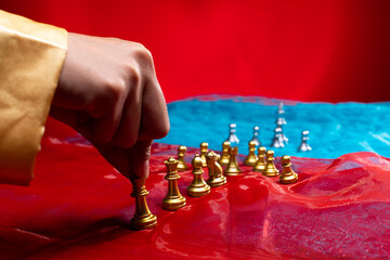 Chess on Red Blue Fabric as abstract of USA, China, Taiwan Crisis Map. Military move force sanction to stop trade chip technology on Taiwan. Invasion Threat is game tension international. copy space