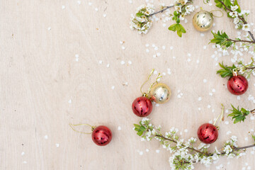 Christmas decorations and a branch with a flower