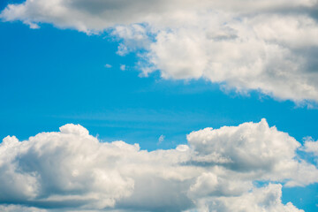 Naklejka na ściany i meble Blue sky with white clouds. on a clear day