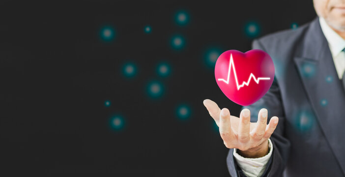 29 Sep 2022, world heart day is an awareness cardiology doctor help patient care blood donate concept, red heart on a blue background and copy space, businessman