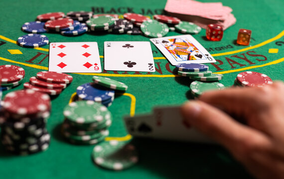 Player peeking cards in Blackjack game