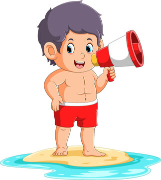The boy is standing on the beach and talking with toa