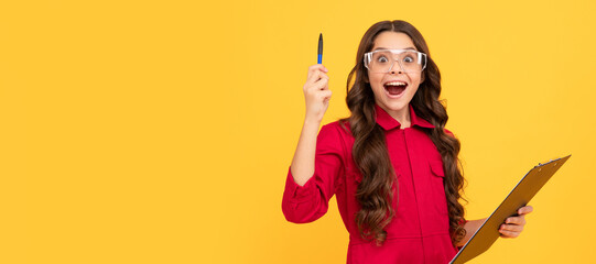cheerful child girl in glasses inspired with great idea, creativity. Child builder with protective glasses horizontal poster design. Banner header, copy space.